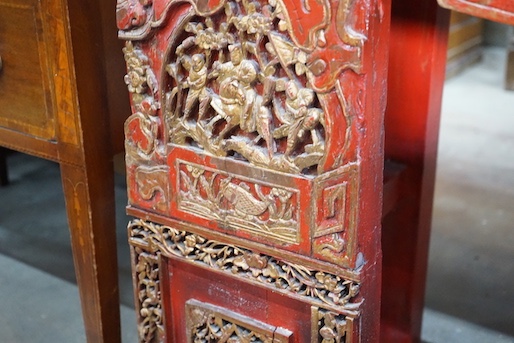 A Chinese carved scarlet and gilt painted altar table with faux stone top, length 198cm, depth 41cm, height 98cm